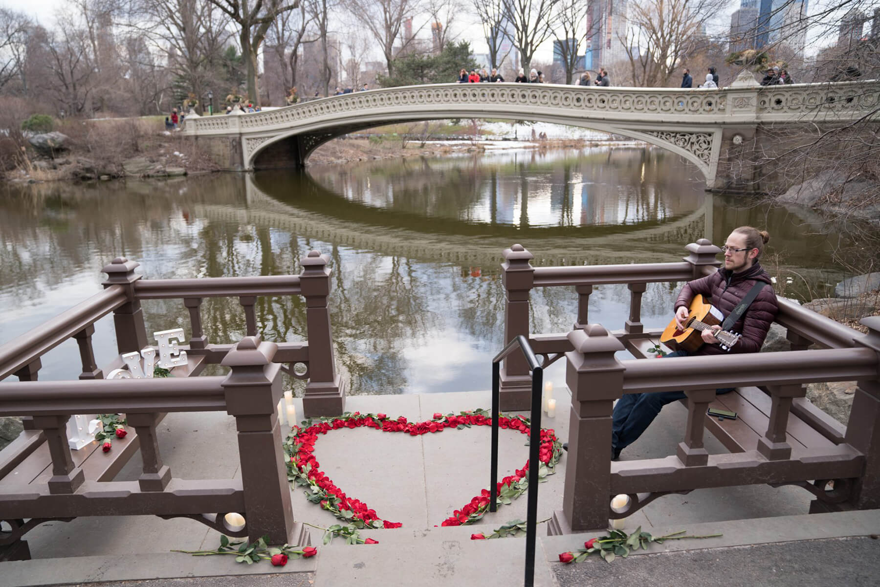 Romantic Proposal By the Bow Bridge with Musician and Rose Heart 2