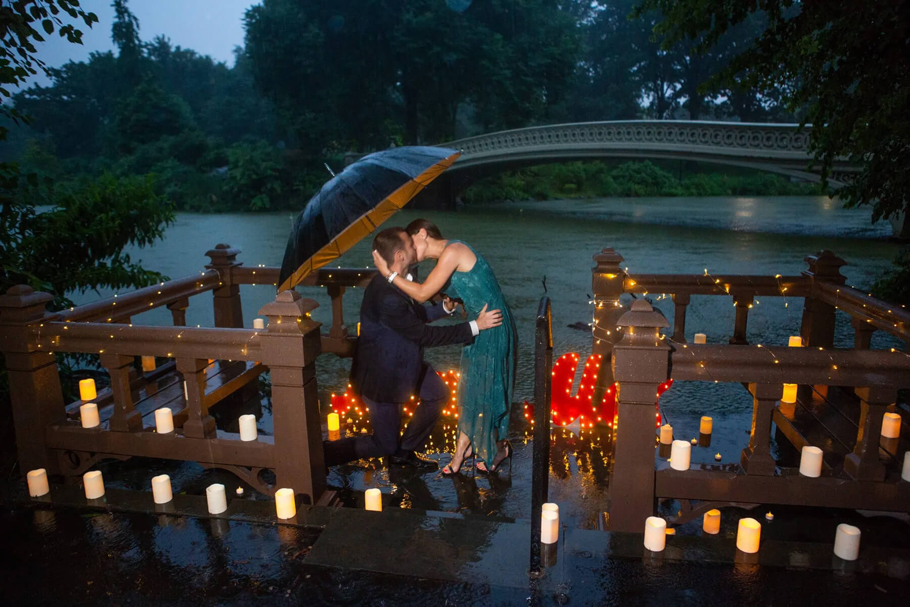 Beautiful candlelight proposal under the rain 4