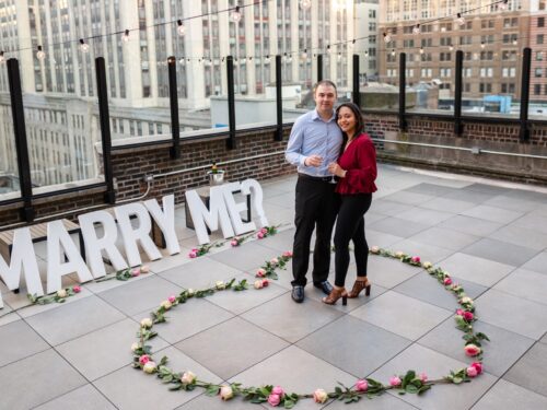 Elegant rooftop proposal with the Empire State Building view