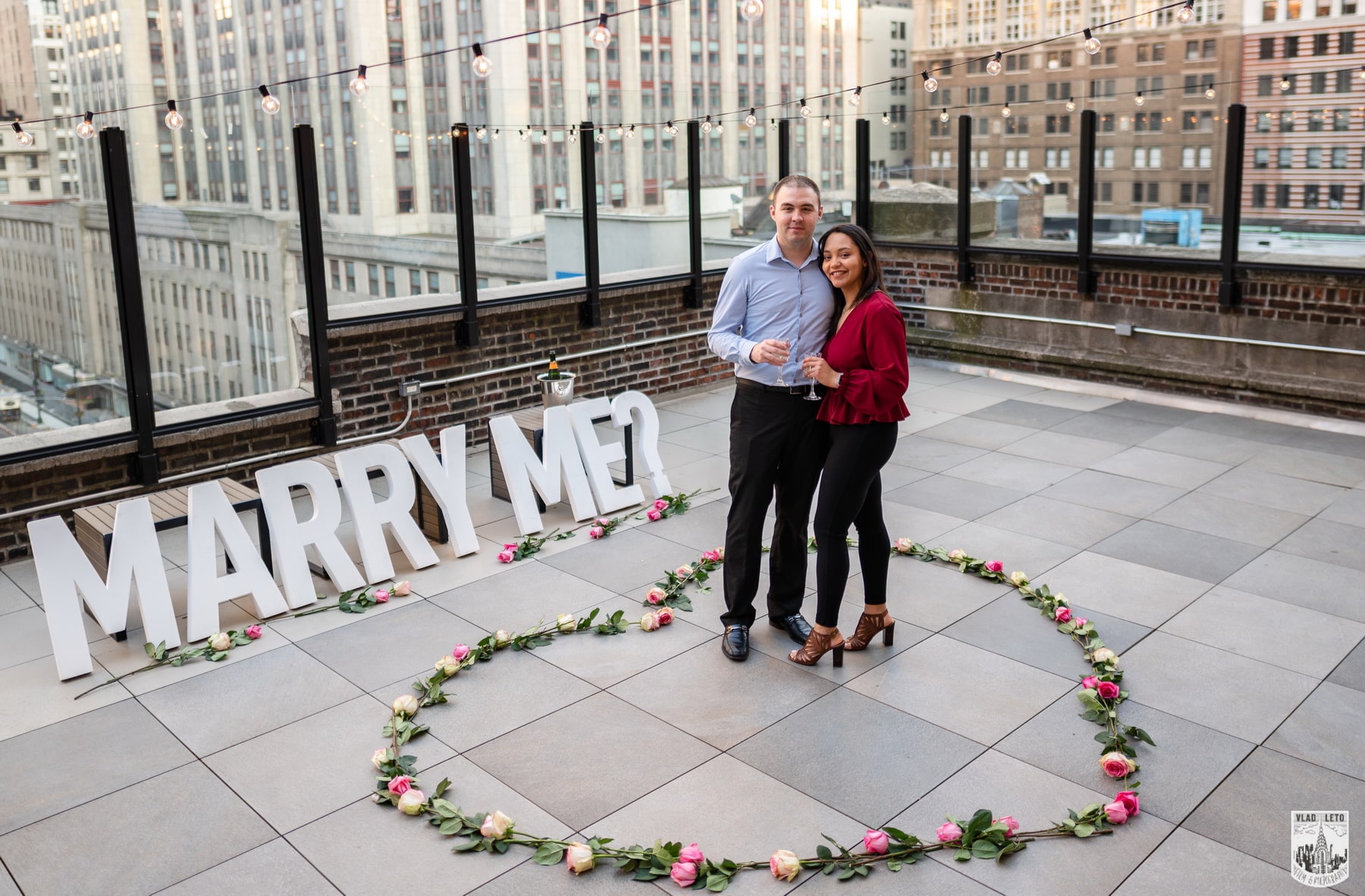 Elegant rooftop proposal with the Empire State Building view