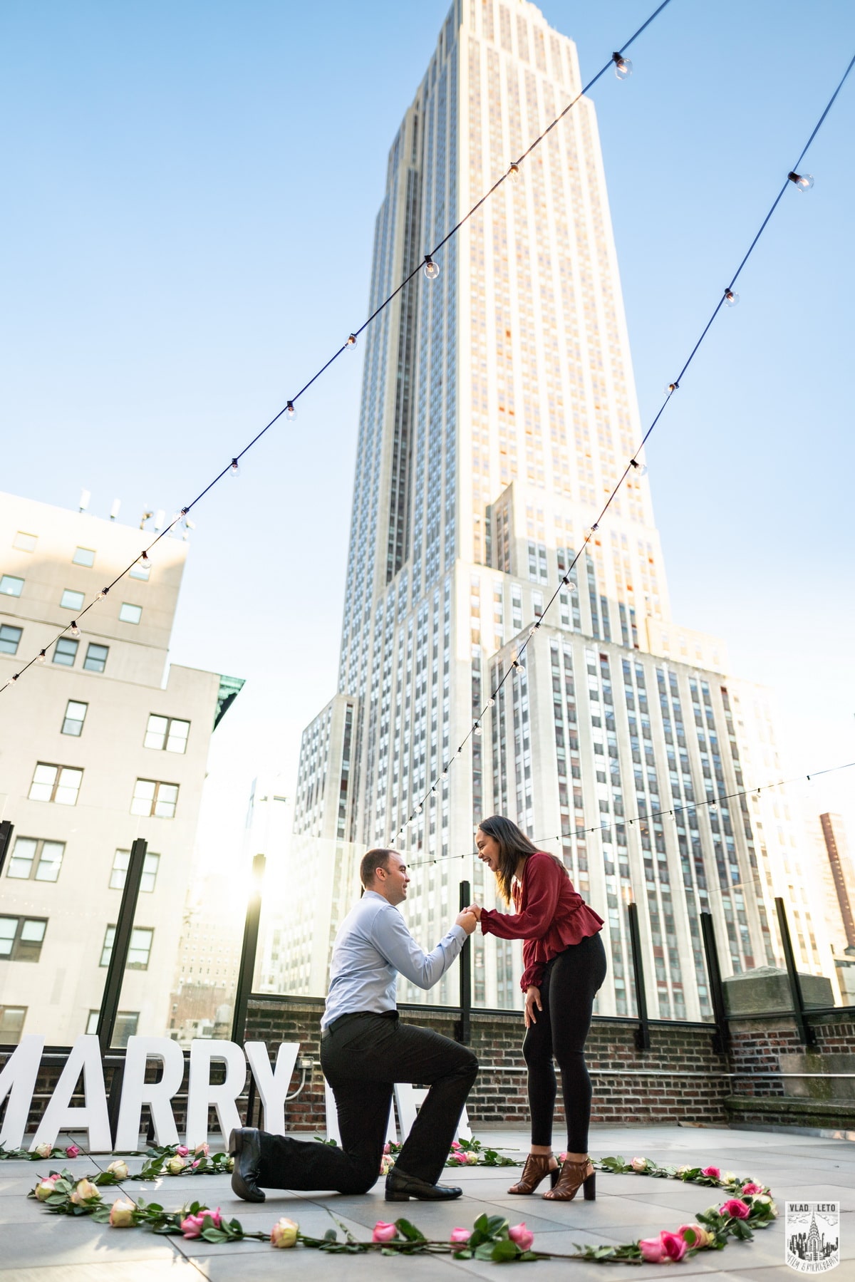 Elegant rooftop proposal with the Empire State Building view