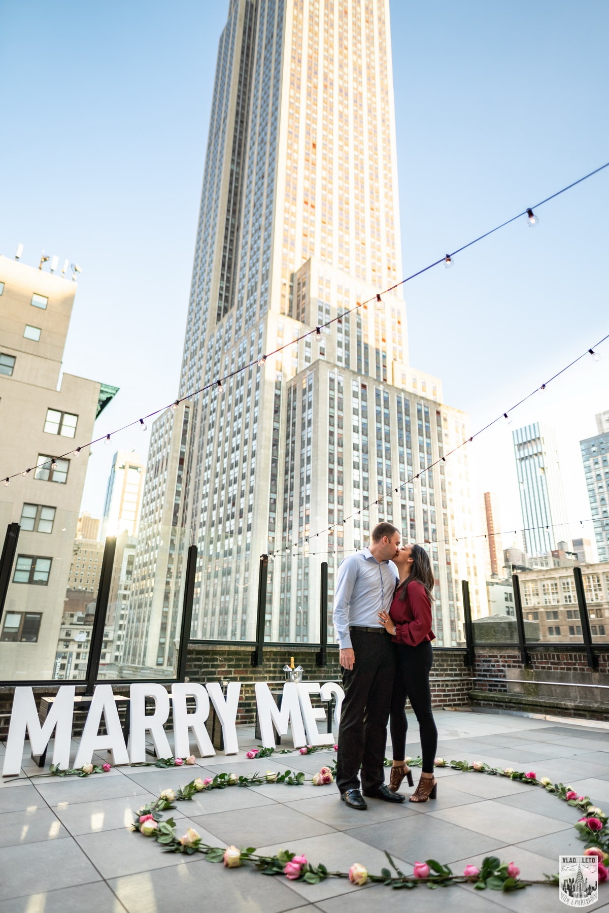 Elegant rooftop proposal with the Empire State Building view