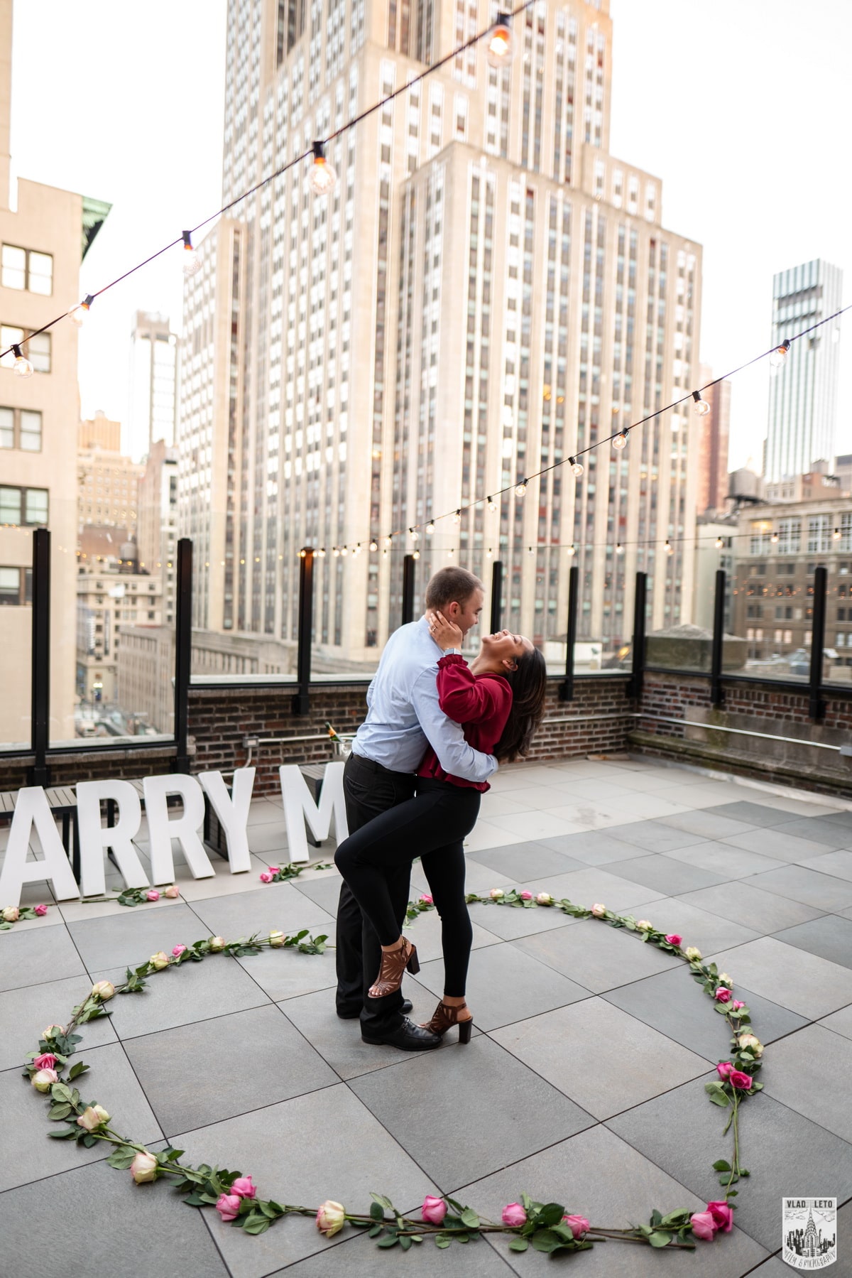 Elegant rooftop proposal with the Empire State Building view