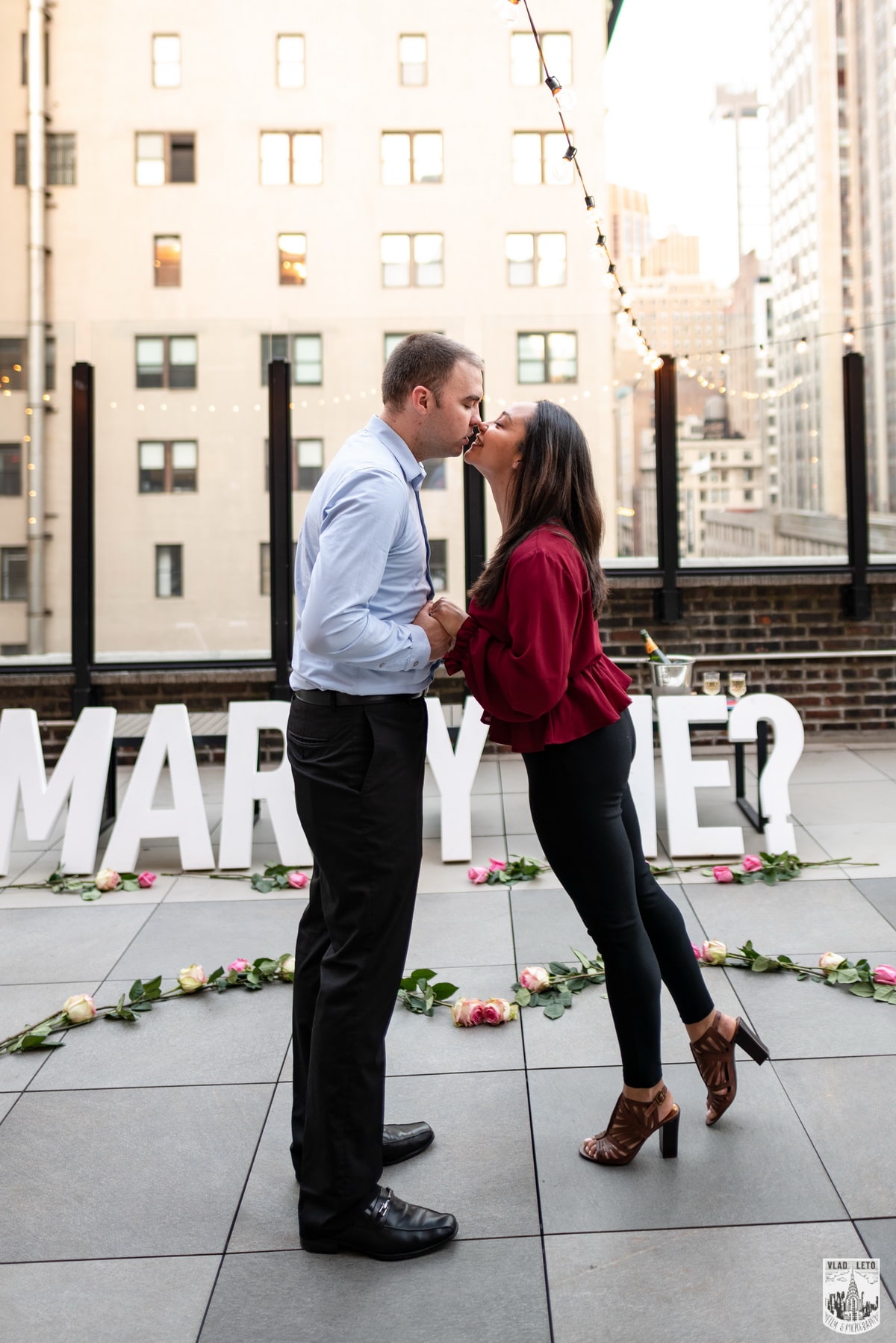 Elegant rooftop proposal with the Empire State Building view