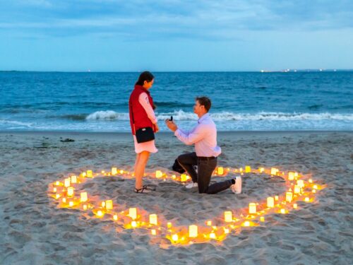 Intimate candlelight proposal on the beach