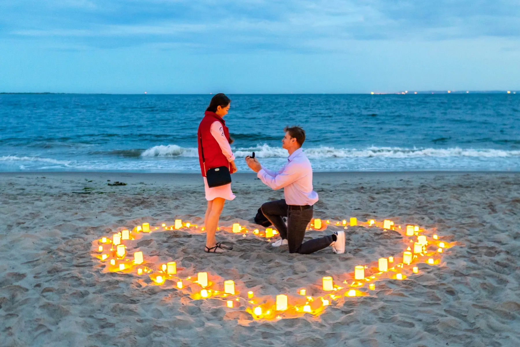 Intimate candlelight proposal on the beach