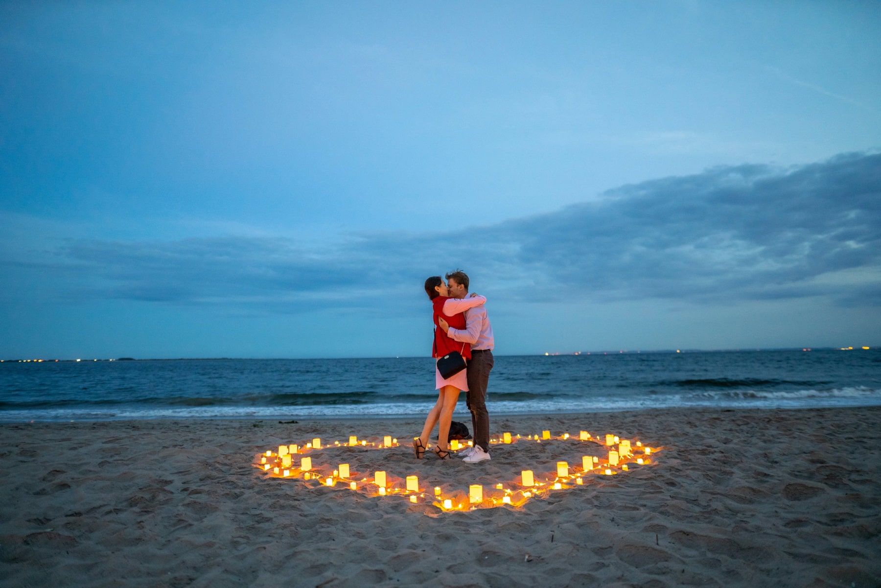 Intimate candlelight proposal on the beach