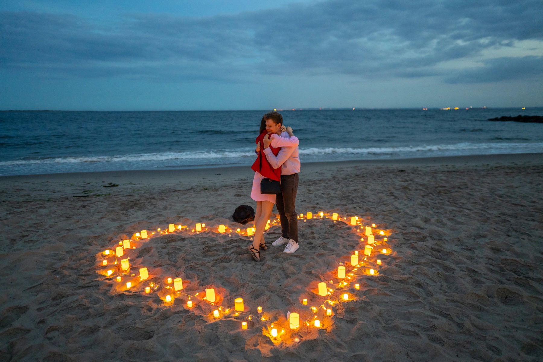 Intimate candlelight proposal on the beach