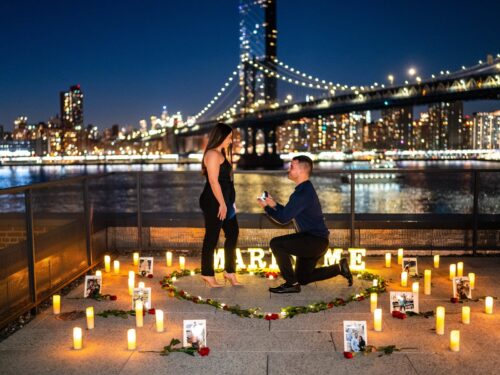 Candlelight proposal with the Brooklyn Bridge on the background