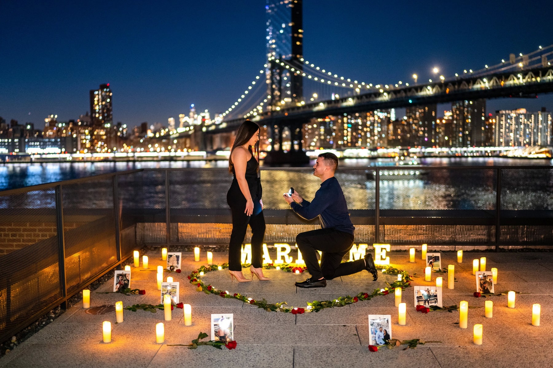 Candlelight proposal with the Brooklyn Bridge on the background